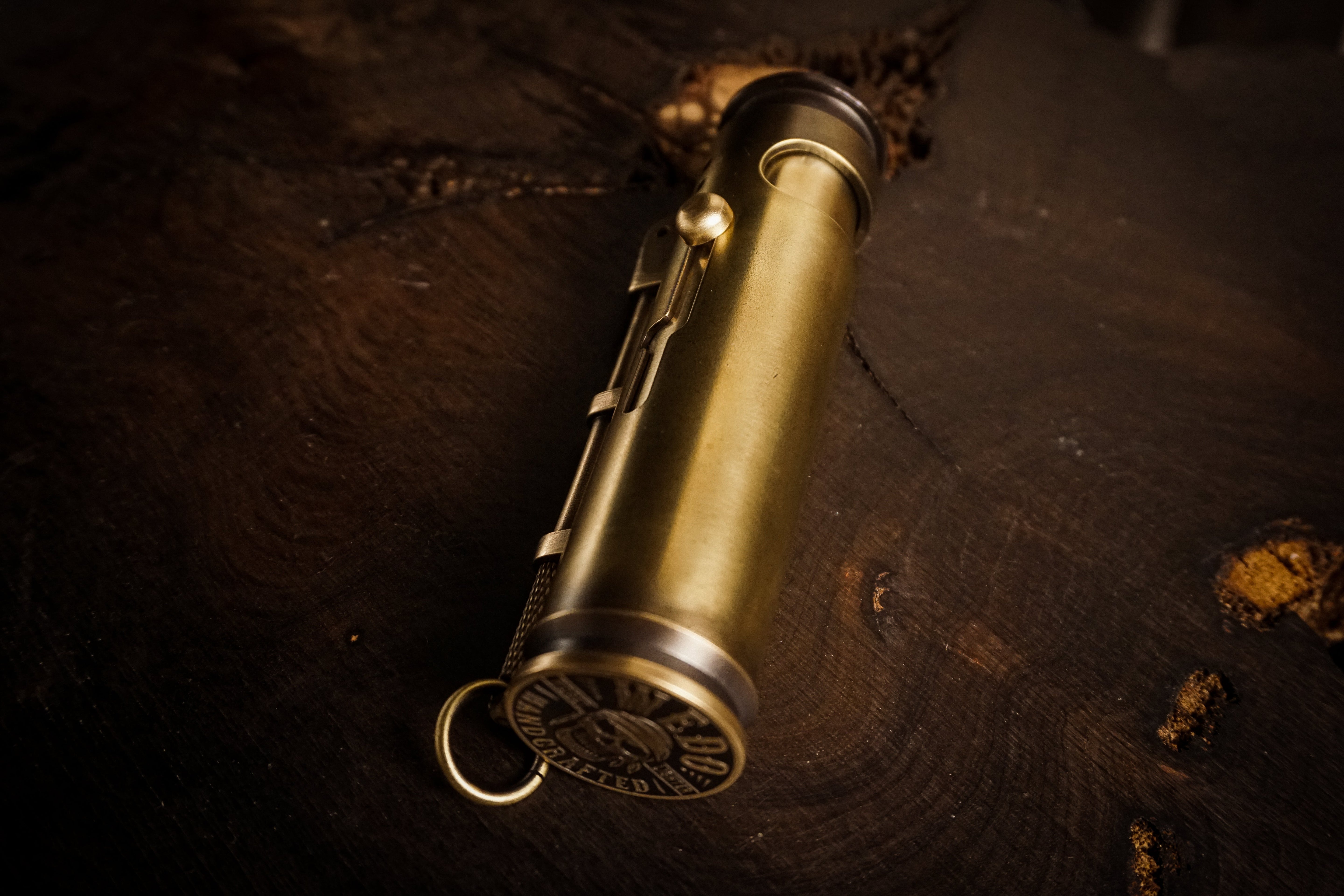 Brass lighters on dark leather for a thoughtful gift decision