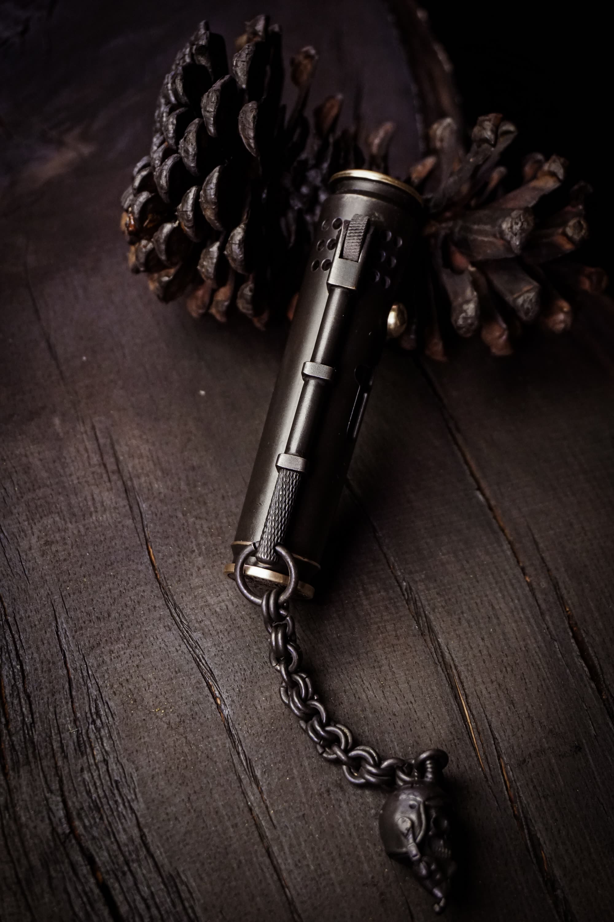 Large Void Korps rear lighter mechanism with textured wheel and attached skull chain