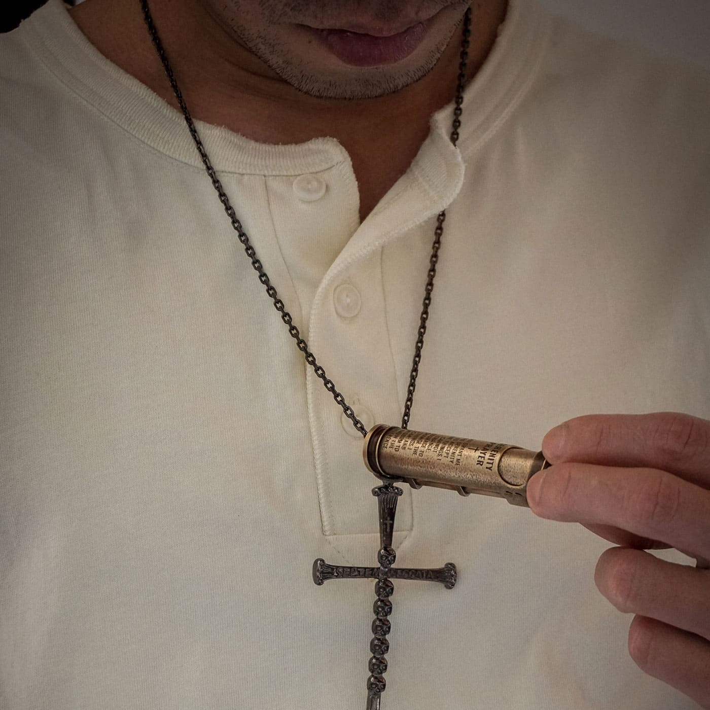 Custom engraved WEDO brass shell lighter worn on a chain as a personal keepsake