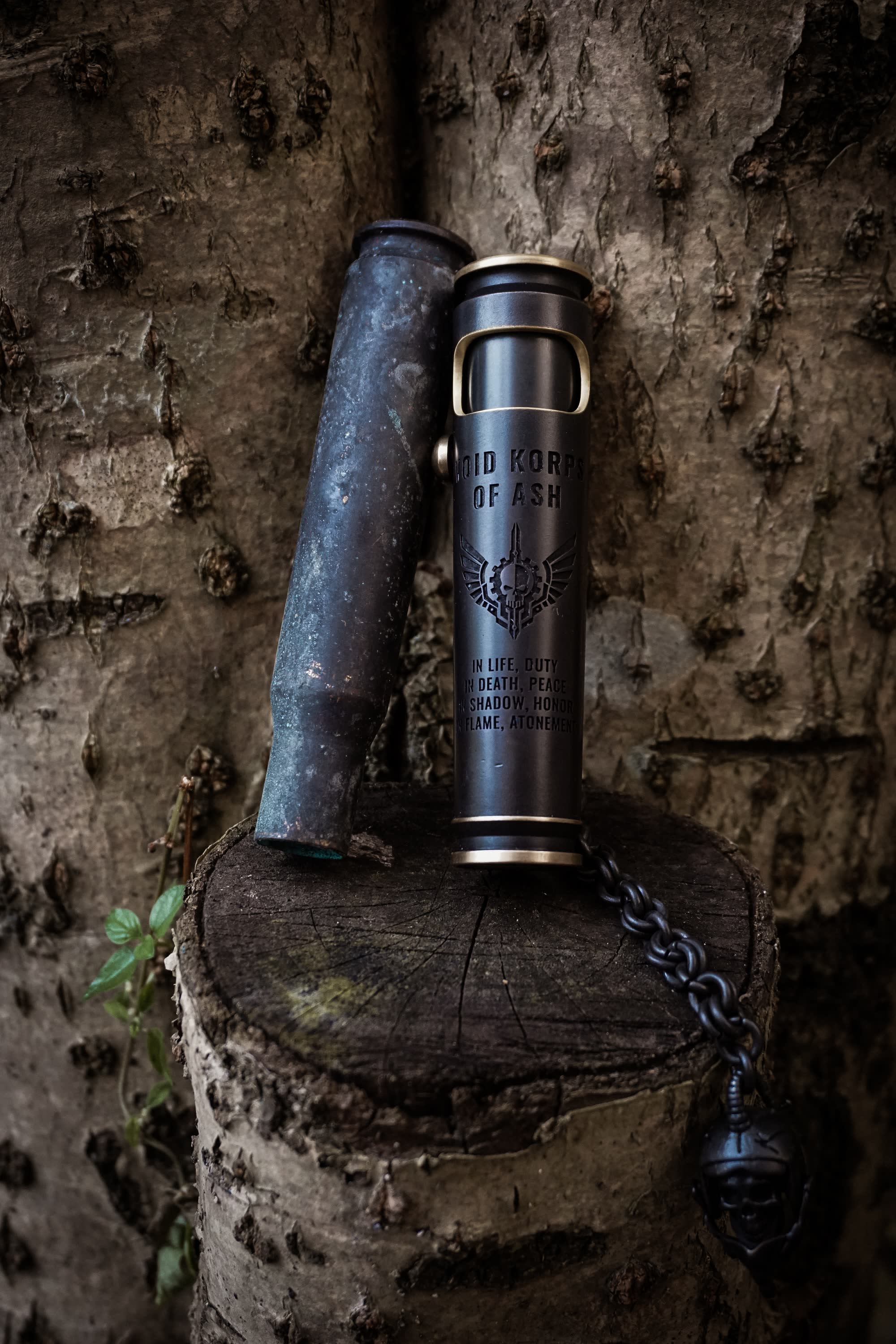Large Void Korps skull lighter with chain shown outdoors for scale