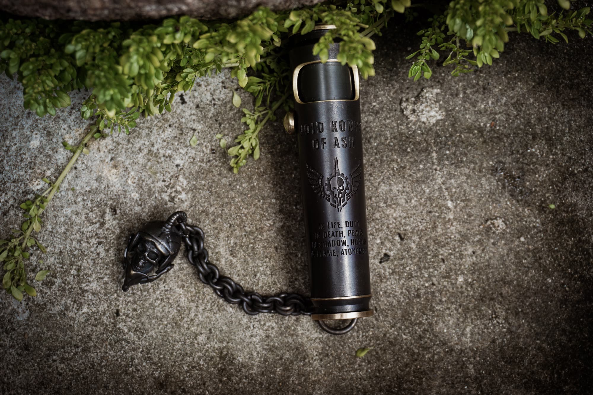 Large Void Korps skull lighter in a wide dark fantasy outdoor scene
