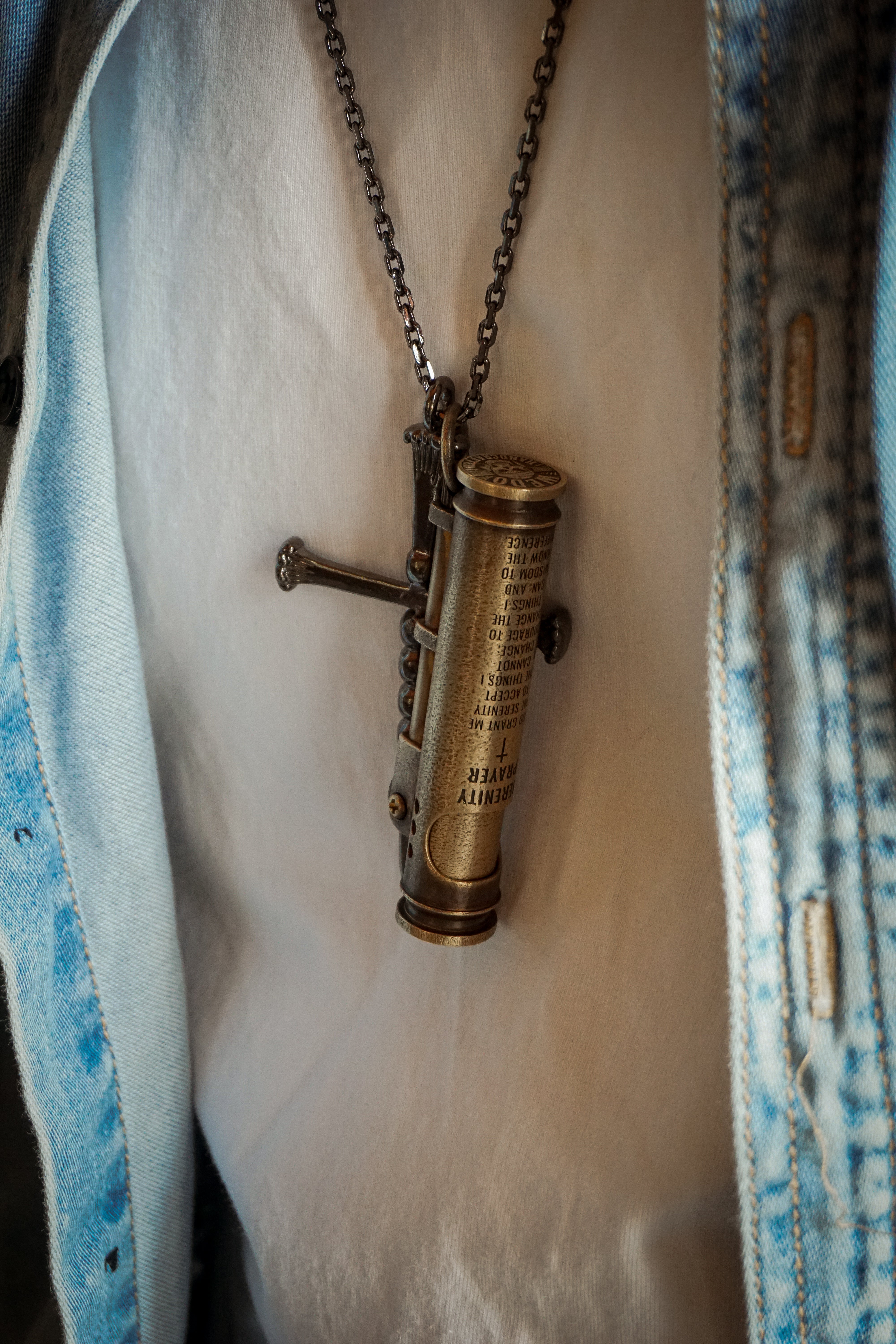 Brass Trench Lighter hanging on the chest