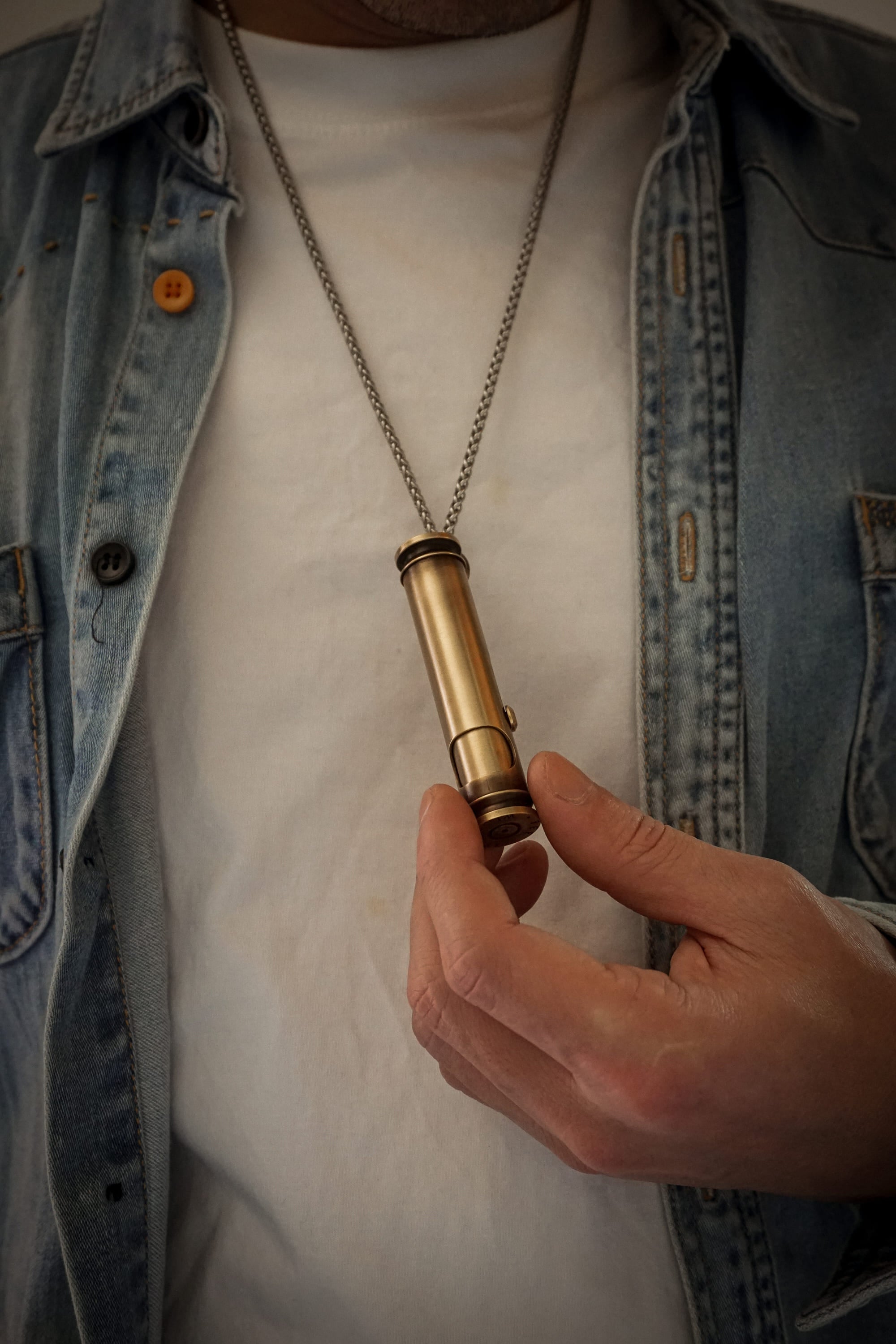 Grab the Cool Vintage Lighter hanging on your chest.