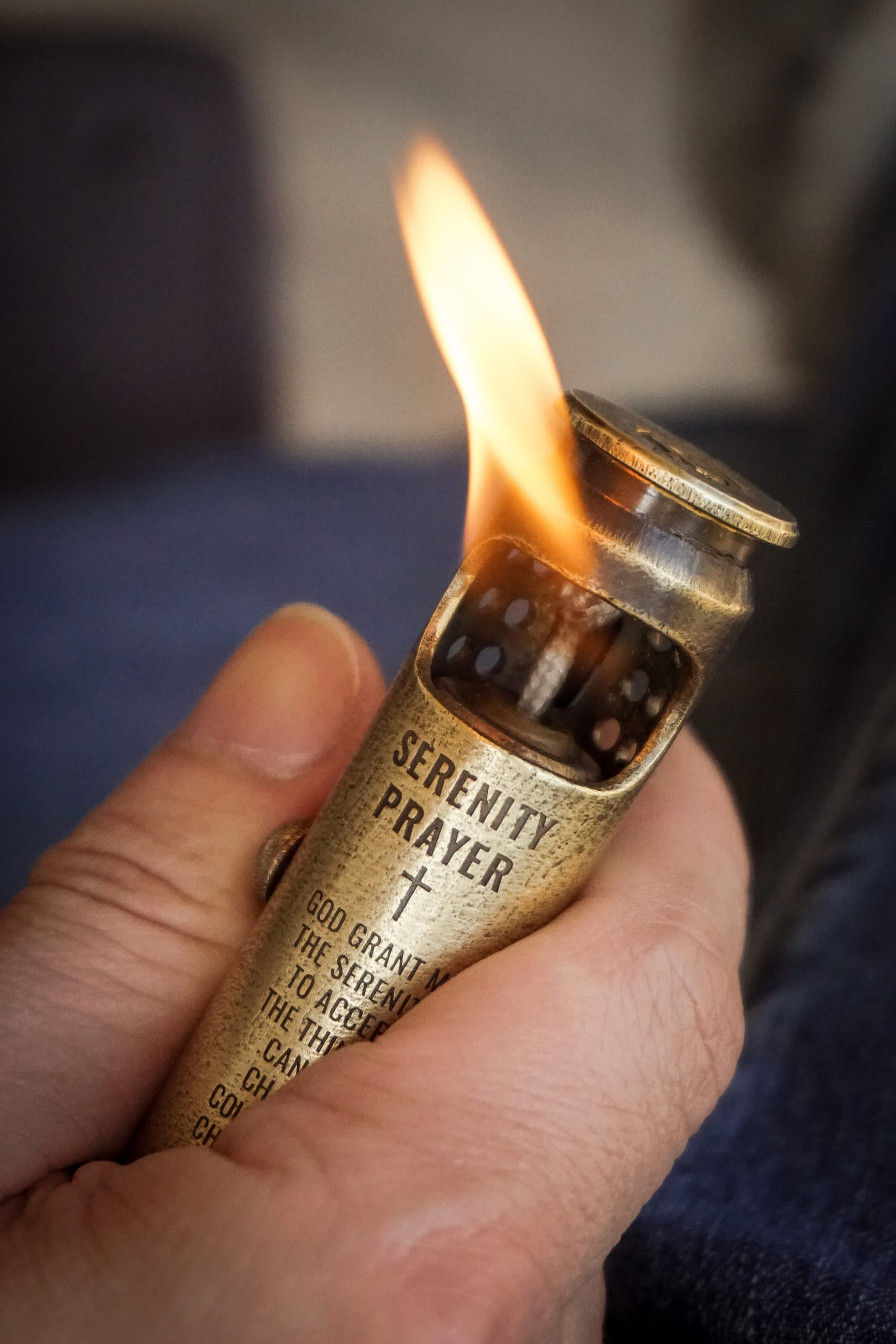 Collectible Lighter lights fire in hand