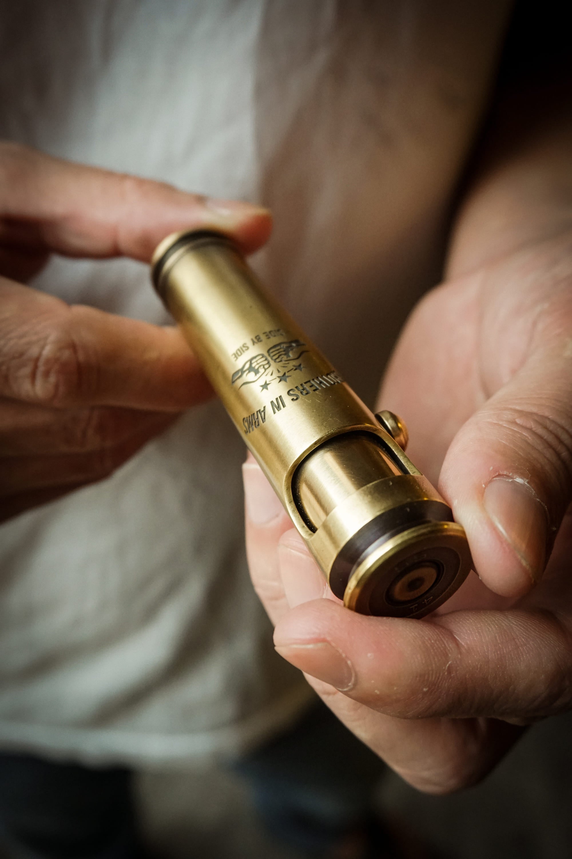 Side by Side engraved brass shell lighter