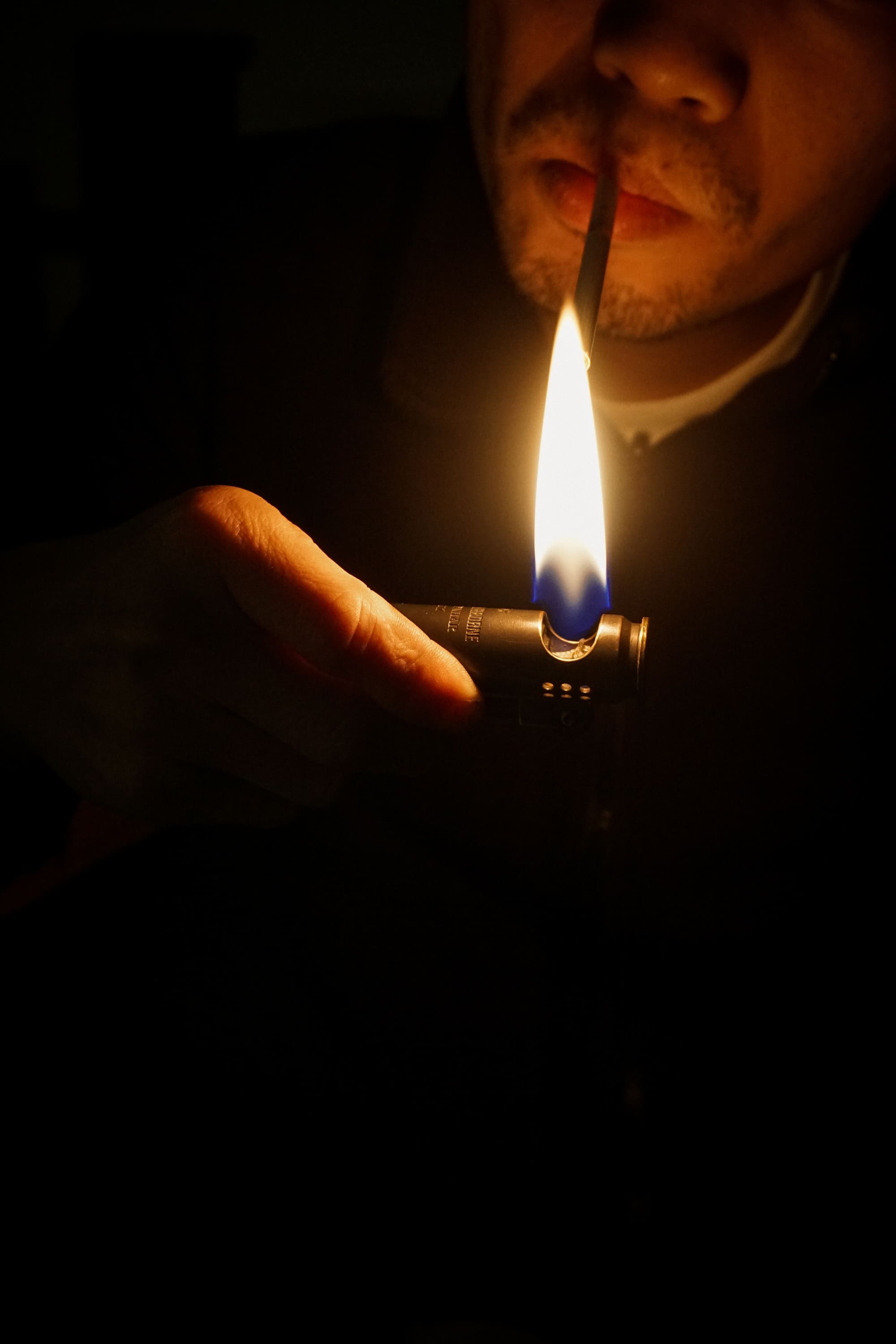 Engraved Lighter is lighting up a cigarette