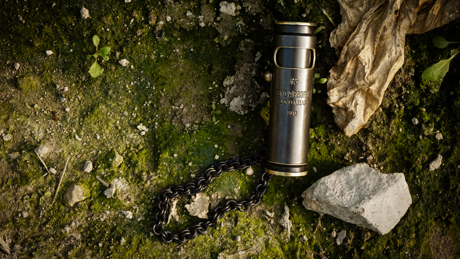 Extra-large WEDO Pirate Black military commemorative lighter photographed on moss and stone