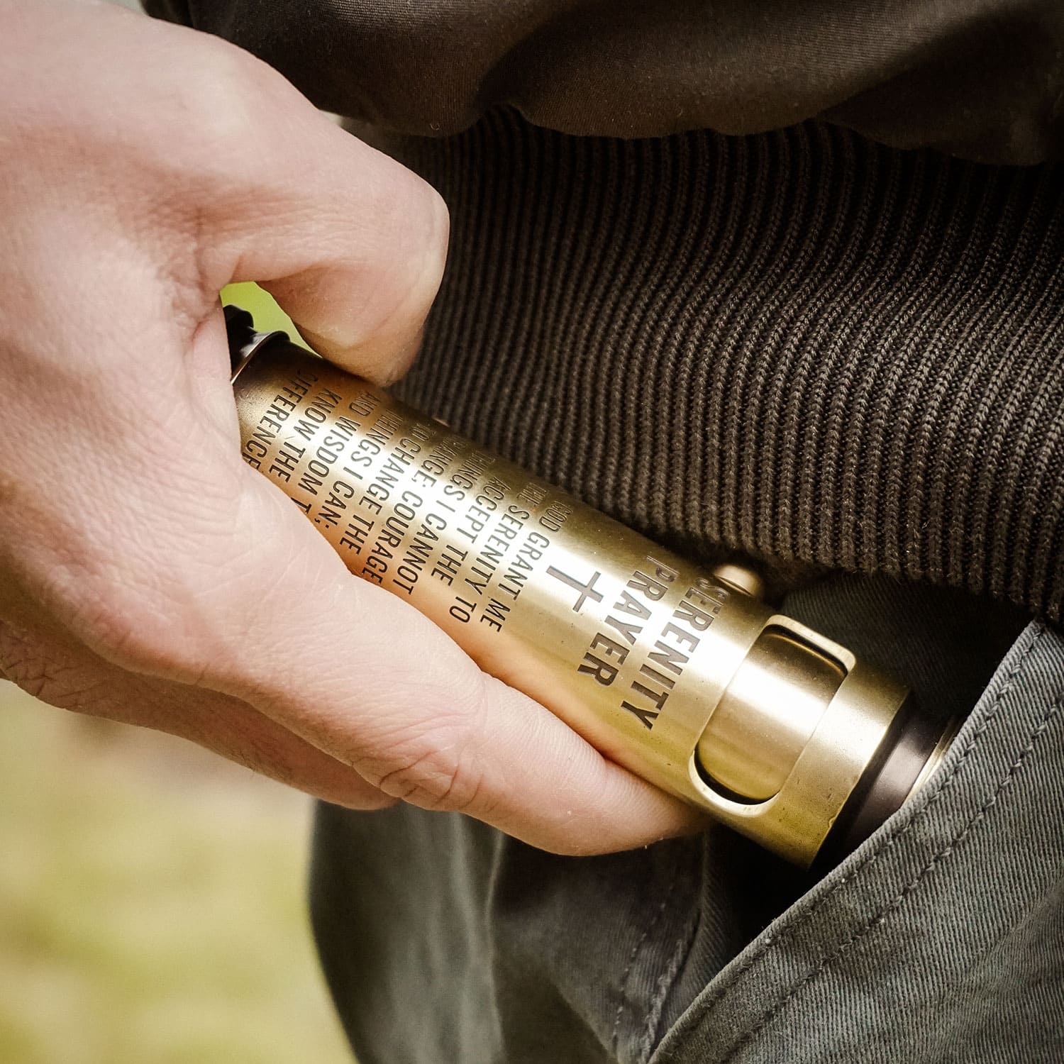 Custom engraved WEDO brass bullet shell lighter carried as a personal keepsake