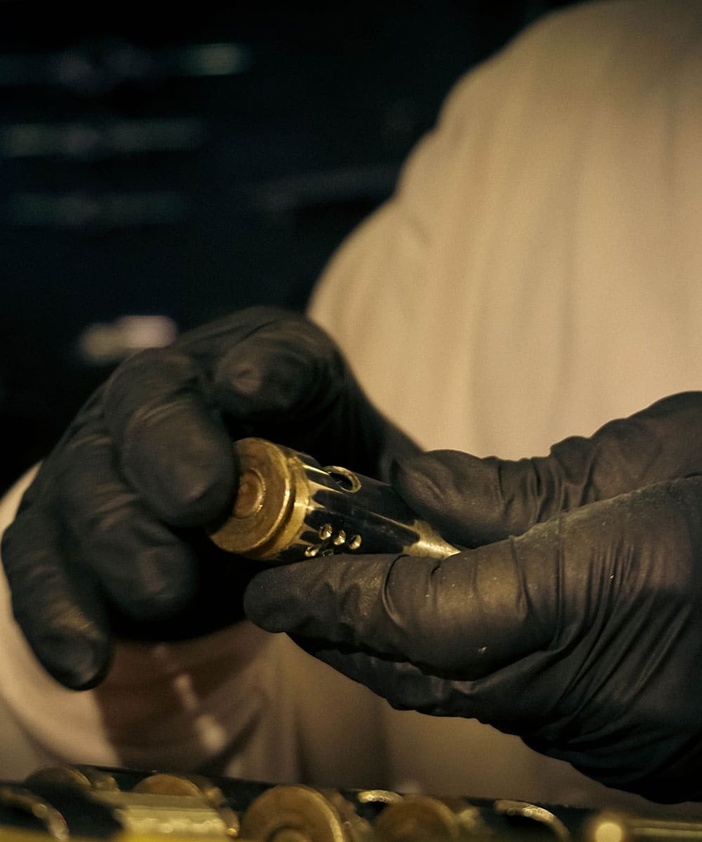 Checking the fit and finish of a handmade WEDO brass shell lighter